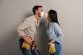 Manual workers kissing in safety masks