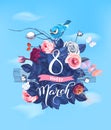 Happy 8 March. Hand lettering on blooming rose bush and little bird sitting on top against blue spring sky and clouds on Royalty Free Stock Photo