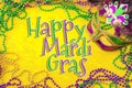 Happy Mardi Gras and Fat Tuesday carnival concept theme with close up on a face mask full of color, feathers and texture and Royalty Free Stock Photo