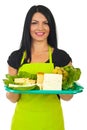 Happy market worker serving cheese