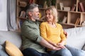 Happy Marriage. Portrait Of Smiling Middle Aged Spouses Embracing At Home Royalty Free Stock Photo