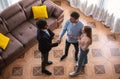 Cheerful married couple and friendly realtor shaking hands after making real estate deal indoors, above view Royalty Free Stock Photo