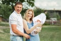 Happy married couple looking at their newborn baby Royalty Free Stock Photo