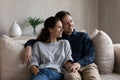 Happy married couple relaxing on couch at home Royalty Free Stock Photo