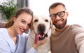 Happy married couple  taking selfie with their favorite pet dog   at home Royalty Free Stock Photo