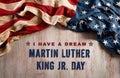 Happy Martin Luther King Day concept. American flag againt old wooden background