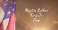 Happy martin luther king day jr text and american flag against spot of light in background Royalty Free Stock Photo
