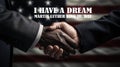 Happy Martin Luther King jr day. I have a dream text and white and black handshake