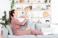 Happy Maternity Leave Time. Young Mom Playing With Toddler Son At Home Royalty Free Stock Photo