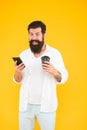 Happy mature bearded man use phone while drinking morning coffee, nice video call