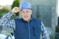 happy mature builder looking at camera