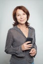 Happy mature business woman with cell phone Royalty Free Stock Photo