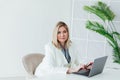 Happy mature business woman entrepreneur in office using laptop at work, smiling professional middle aged 40 years old Royalty Free Stock Photo