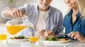 Happy Mature Couple Eating Tasty Breakfast In Kitchen At Home Royalty Free Stock Photo