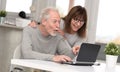 Happy mature couple having a good surprise on laptop Royalty Free Stock Photo