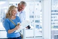 Happy mature couple reading map Royalty Free Stock Photo