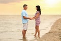 Happy mature couple spending time together on beach Royalty Free Stock Photo