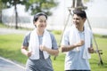 Happy mature couple  in summer sports running outfit. Asian man and woman running outdoors Royalty Free Stock Photo