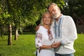 Happy mature couple in Ukrainian national clothes outdoors Royalty Free Stock Photo