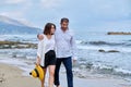 Happy mature couple walking on the beach Royalty Free Stock Photo