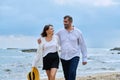 Happy mature couple walking on the beach Royalty Free Stock Photo