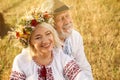 Happy mature couple wearing Ukrainian national clothes in field Royalty Free Stock Photo