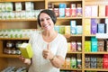 Mature female customer holding supplements Royalty Free Stock Photo