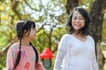 Happy mature grandmother and smiling little grandchild walking, enjoying spending time together in summer park Royalty Free Stock Photo