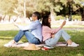 Happy Mature Husband And Wife Relaxing With Smartphones Outdoors In Park Royalty Free Stock Photo