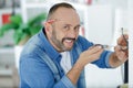 happy mature man doing diy Royalty Free Stock Photo