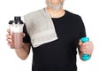 Mature man with protein shake and dumbbell Royalty Free Stock Photo