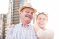 Happy mature man smiling with young woman Royalty Free Stock Photo