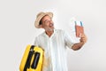 Happy Mature Man With Travel Suitcase Showing Tickets, Gray Studio