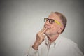 Happy mature man in white shirt thinking looking up Royalty Free Stock Photo