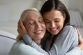 Loving elderly mother and adult daughter hug at home Royalty Free Stock Photo