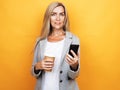Happy mature old 60s woman with long hair holding smartphone Royalty Free Stock Photo