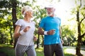 Happy mature people couple exercising for healthy life