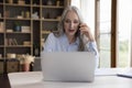 Happy mature 50s business professional woman answering mobile phone call Royalty Free Stock Photo