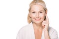 happy mature woman applying cosmetic cream Royalty Free Stock Photo