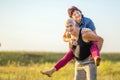 Happy mature woman climbed on her husband