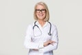 Happy mature woman doctor portrait isolated on grey background Royalty Free Stock Photo