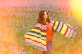 Happy mature woman in flower field enjoys life Royalty Free Stock Photo