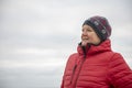 Happy mature woman outdoors on a cold day Royalty Free Stock Photo