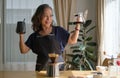 Happy mature woman preparing coffee for breakfast in comfortable home kitchen. Retirement, Healthy seniors lifestyle Royalty Free Stock Photo