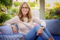 Happy mature woman relaxing at home in the backyard Royalty Free Stock Photo