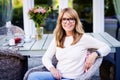 Happy mature woman relaxing at home in the backyard Royalty Free Stock Photo