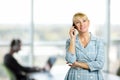 Happy mature woman talking on cell phone. Royalty Free Stock Photo