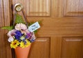 Happy May Day gift of flowers on door. Royalty Free Stock Photo