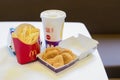 Happy Meal menu at McDonald`s restaurant. Happy Meal Kids Next to Cheeseburger, Drink and Chicken McNuggets. Time for a snack,