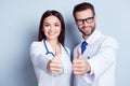 Happy medic workers. Portrait of two doctors in white coats and Royalty Free Stock Photo